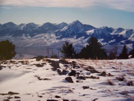 This summit view looks SW across Birch Creek Valley to Diamond Peak (center) and 5 Lemhi Range Eleveners. Photo 11/9/96 by Rick Baugher
